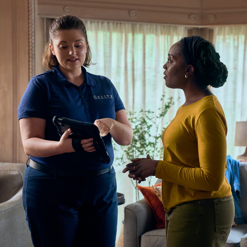 An Elite Comfort Advisor discuss our Comfort360 Membership benefits with a homeowner.